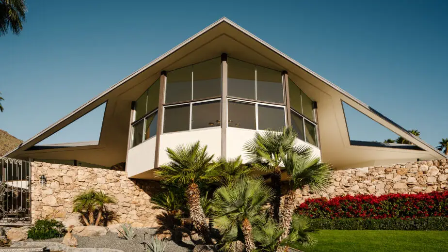 Imagine stepping into a time capsule where the future of architecture meets the charm of history. That's precisely what the House of Tomorrow offers. Located amidst the picturesque backdrop of the San Jacinto Mountains, this architectural gem was commissioned by the Alexander Construction Company and masterfully crafted by renowned architect William Krisel in 1960. With its unique design of four interconnected circular structures, the house provides stunning panoramic views that make it seem as if it were a spacecraft poised above the desert sands. Elvis Presley and his bride Priscilla had initially set their sights on marrying at this very location in the spring of 1967. However, swamped by media attention, they opted for a Las Vegas wedding and reserved the House of Tomorrow as their honeymoon retreat, earning it the charming nickname "Honeymoon Hideaway." This residence became symbolic of the glittering lifestyle of the 60s, where the living room's rock wall and a spacious pool beckoned partygoers looking for an escape into luxury.