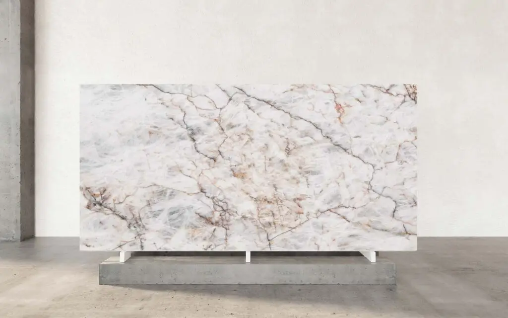 Cristallo Matterhorn Quartzite is a captivating natural stone that mirrors the rugged beauty and dramatic allure of the Matterhorn mountain in the Alps. Its luminous, translucent white base is gracefully intertwined with bold, dynamic veins, creating a striking visual reminiscent of the mountain’s steep peaks and cascading slopes. This intricate veining adds depth and character, reflecting both the majesty of nature and the artistry of design. The polished finish of Cristallo Matterhorn Quartzite amplifies its elegance, offering a radiant sheen that enhances the contrast and complexity of its veining. The smooth, mirror-like surface not only exudes luxury but also showcases the stone's natural brilliance, making it a centerpiece in any space. With its luminous quality, this quartzite elevates interiors, infusing them with light and sophistication.