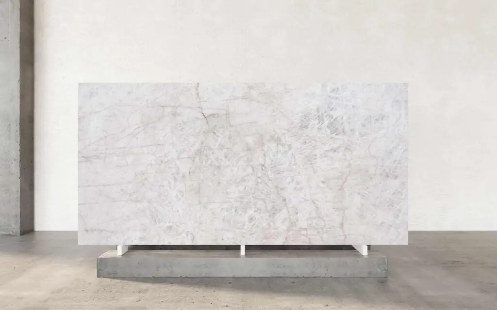 Cristallo Petrus is renowned for its exquisite veining patterns that effortlessly enhance its luxurious appeal. The veining typically features soft, flowing lines that weave through the stone, resembling delicate threads of fine silk. These veins can vary in color, often presenting in subtle shades of white, gold, or grey, which contrast beautifully against the stone's translucent, icy backdrop. Quartzite is a naturally occurring metamorphic rock formed from pure quartz sandstone. Through a process of high heat and pressure, the sandstone is transformed into a dense, durable stone that is highly prized for its aesthetic and functional properties. Quartzite is renowned for its incredible strength and resistance to wear, making it an ideal choice for surfaces subjected to heavy use.